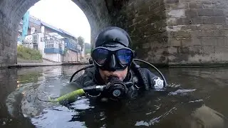 Underwater archeologist shows off small finds from River Wear.