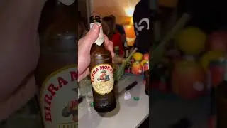 Opening beer bottle with A4 sheet of paper