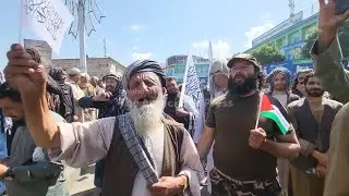 Afghan men march through Kabul in solidarity with Palestinians