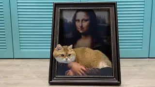 Hosico the cat sits in the arms of Mona Lisa Giocondo
