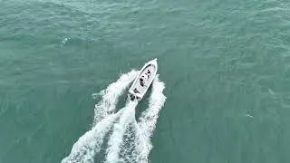 Atlas Boatworks 23F Bay Boat circles around a school of false albacore