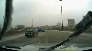Car loses control on an icy highway
