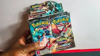 Opening Pokemon Burning Shadows Booster Box - HUNT FOR THE RAINBOW CHARIZARD GX!