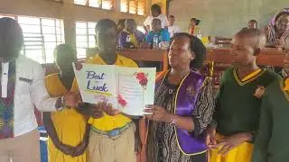 Lion President Elizabeth Kasolo (jinja) giving success Card to the Candidates of Spire Road P.S