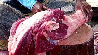 Beef cutting skills by professional butcher at roadside meat shop, Big cow meat cutting skills