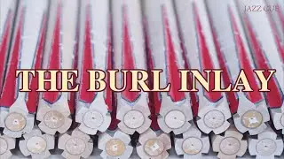 Burl accents enrich the cue, where a single inlay becomes a mark of luxury.