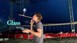 Circus performer glass balance