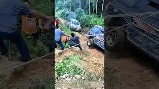 Three-Way Tug: The Coordinated Yank That Freed a Stuck Jeep
