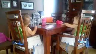 Twin 12 month old meal time fun