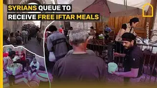 Syrians queue to receive free iftar meals