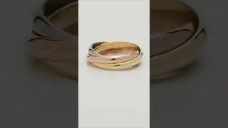 Lot 137: Cartier 18kt Size 69 Trinity Rolling Ring Band