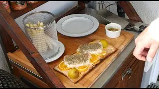 Cedar plank cod on oranges with white asparagus - Roettgen Braai Master