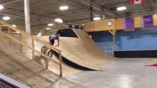 Adult doing a backflip on a BMX