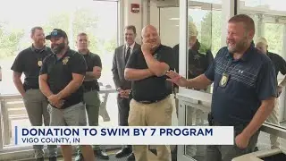 local law enforcement donates to children's swimming program