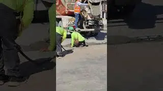 Road Construction Process: Pouring Concrete with Mixer Truck