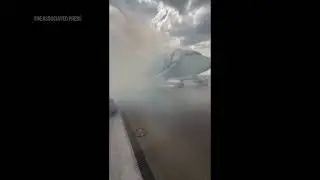Passengers flee smoking jet on emergency slide after apparent landing gear problem at Denver airport