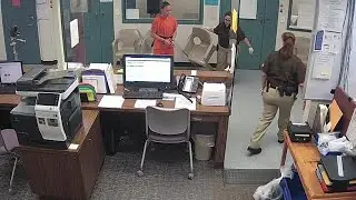 Watch video of an emotional Amber Guyger getting booked into jail