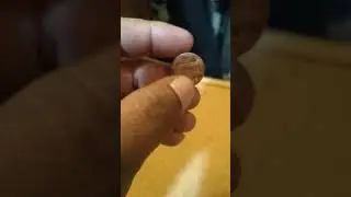 1997 d 1 cent .with a discoloration on front