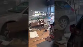 Guy crashes car into building on purpose!?