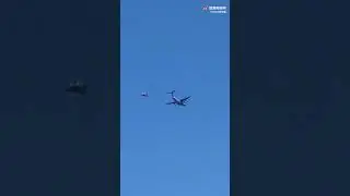 Prototype of the Chinese Yun-20 tanker aircraft simulating air refueling of a fighter jet aircraft.