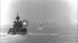 USS Maryland, BB-46, fires main battery guns and another Battleship fires seconda...HD Stock Footage