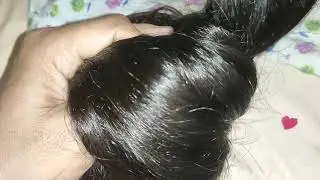 Hair play. Big bun open in night.
