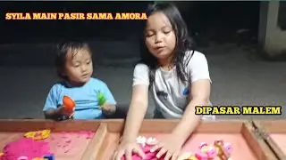 Syila main pasir warna sama amora
