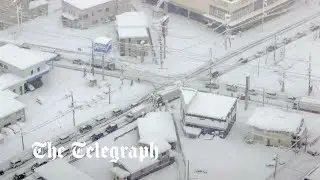 Record snowfall blankets parts of Japan disrupting travel