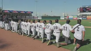 Roosevelt Roughriders baseball team takes a knee during National Anthem of season opener