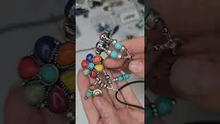 The trick to using 2 hole slider beads with leather.  