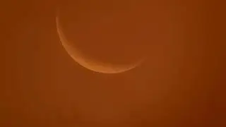SUNSET 11 KM ABOVE TITAN AND EARTH'S CRESCENT MOON IN THE COLOURS OF THE SUNSET AT TITAN.