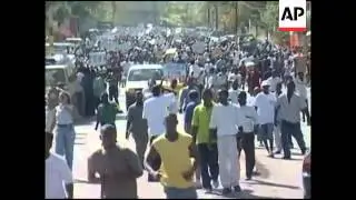 Thousands demand trial for Aristide