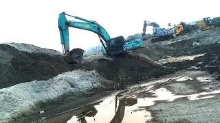 Mixed excavator, long boom crane, dump truck loader, construction site
