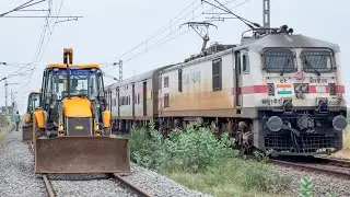JCB 3DX working on Railway Track to Removes Unwanted Grass and Trees between Two Railway lines
