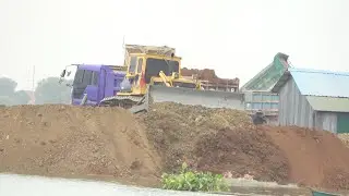 Incredible deep pond filling machinery operator Bulldozer and trucks