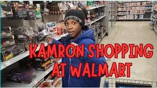 Kamron shopping at Walmart for toys, hot wheels, walkie talkie, dinosaurs and more