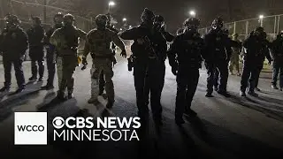 Cameras catch protesters attempt to jump fence outside Whipple building in Minneapolis