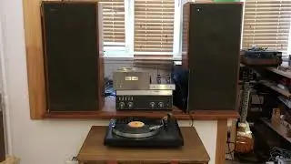 Dire Straits from Linn Basik with Shure M75ED through Phlanger RIAA and Revox on Celestion Ditton 44