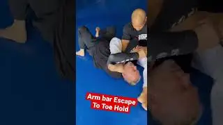 Arm bar escape to toe hold