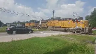 UP 6921, A GE AC4460CW leads rock train through duval road