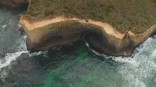 4k aerial high cliff on turquoise water drone overhead shot FREE STOCK VIDEO