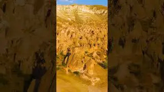 Vertical video. Goreme, Nevsehir, Turkey. Panoramic drone view of vast Zelve Valley complex showi...
