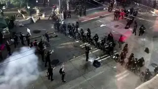 Seattle police use flash bangs to move protesters on street