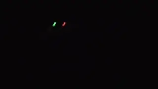 Bell 407 flying overhead at night