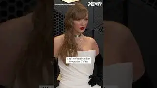 Taylor Swift wearing a black and white Schiaparelli gown to the 2024 Grammys with date Lana Del Rey