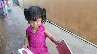A one-and-a-half-year-old child reads a book #baray #ev