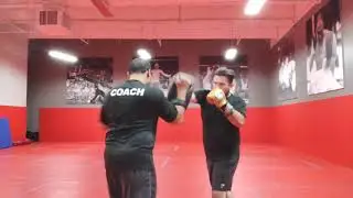 Coach Anthony Castaneda UFC Gym La Mirada Hitting Thai Pads