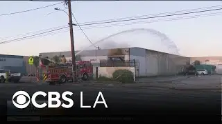 Fire crews continue to work for a second day at a South El Monte recycling center blaze