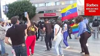 Anti-ICE Protesters Dance In Front Of Police Line In Los Angeles, California