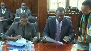 Signing and handover of certificates by CS JB Muturi to AG Dorcas Oduor